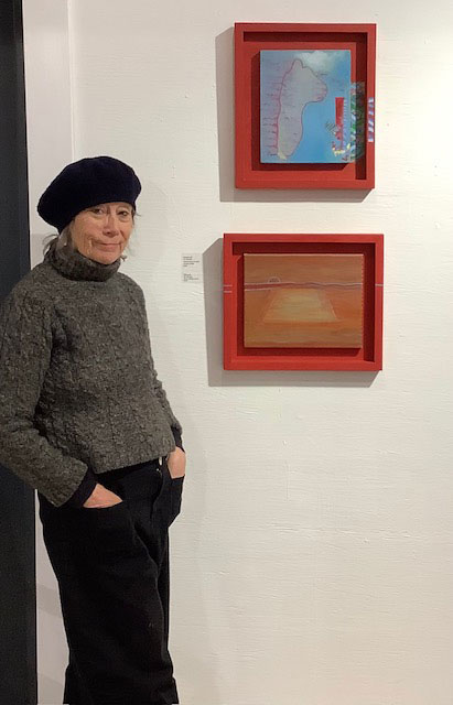 Contemporary Artist Viv Allbright stood with two of her paintings